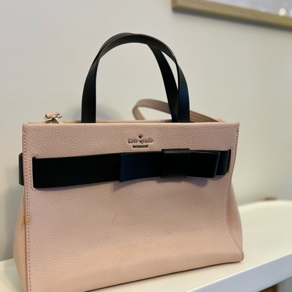 kate spade pink satchel with black bow accents